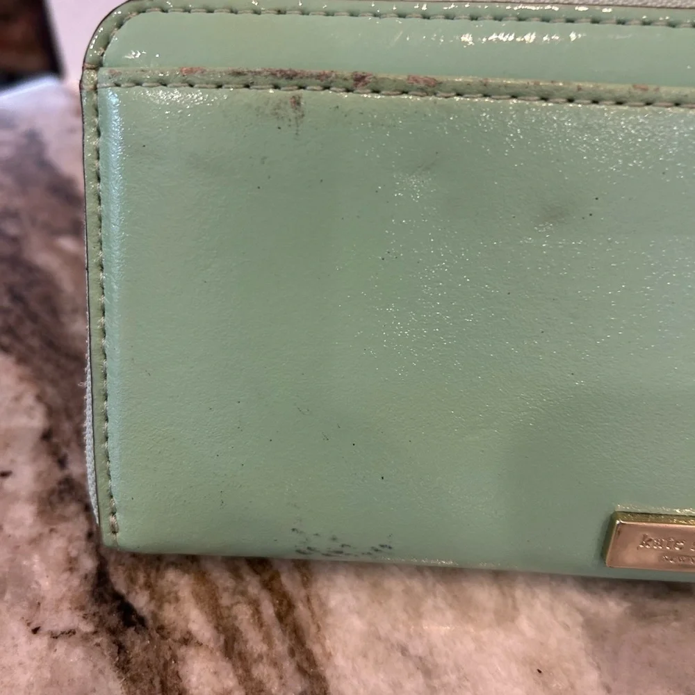 Kate Spade Chelsea park mint Wallet with Bow Accents has wear stains